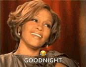 a woman is smiling and saying goodnight with a smiley face on her face .