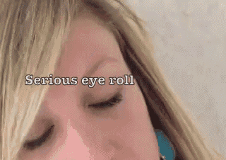 a close up of a woman 's face with the words " serious eye roll " written above her
