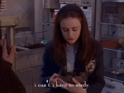 a girl in a school uniform is holding a bowl of food and says i can t i have to study