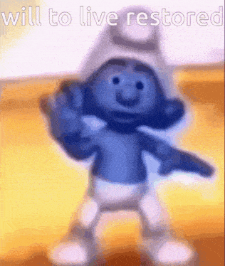 a smurf is dancing with the words will to live restored above him