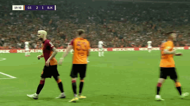 a soccer game is being played with a score of gs 2 1 bjk