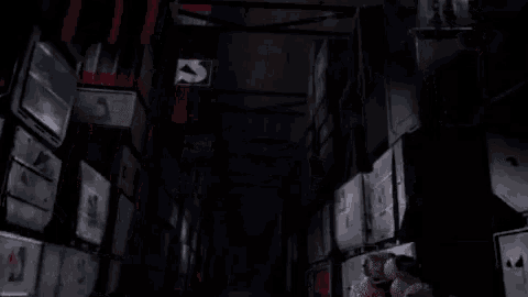a dark room with a few flags hanging from the ceiling one of which has the letter s on it