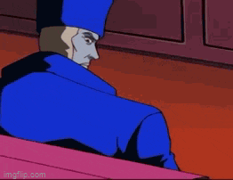 a cartoon character with fangs is wearing a blue jacket