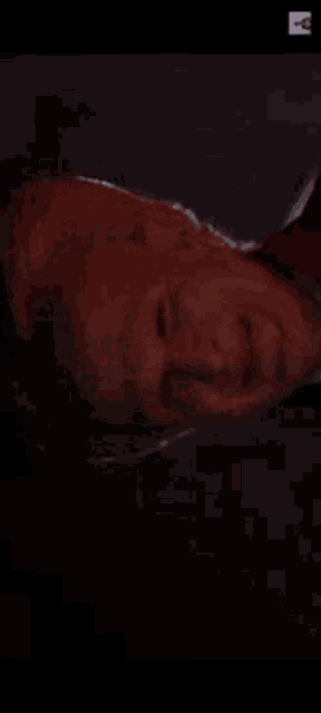 a close up of a person 's face with blood coming out of it