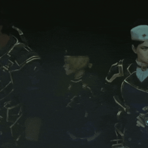a group of soldiers are standing in a dark room and one of them is wearing a beret
