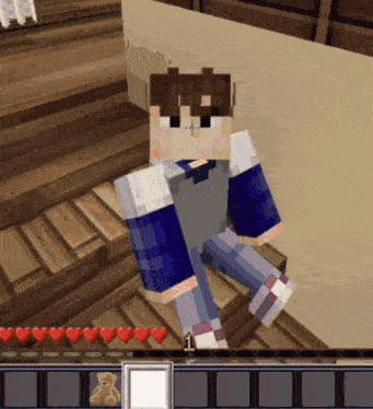 a minecraft character sitting on a set of stairs