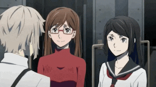 a man and two girls are standing next to each other in a room .