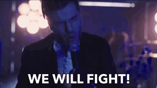 a man in a suit says we will fight