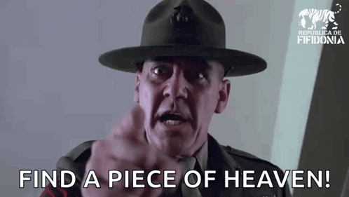 a man in a military uniform is pointing at the camera and says find a piece of heaven