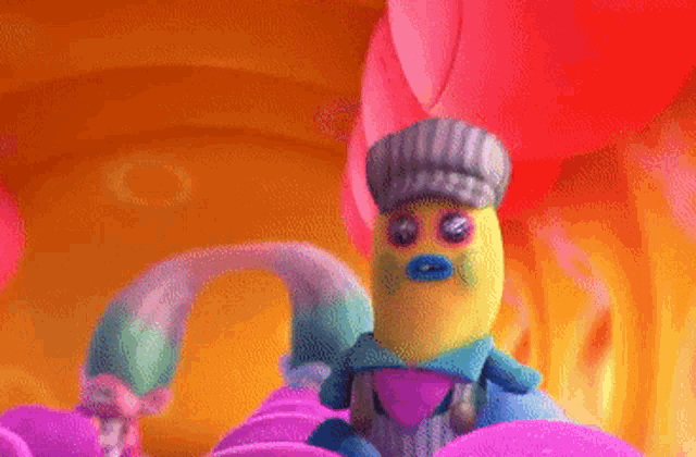 a cartoon character is sitting on a couch with a pink heart in his hand .