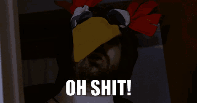 a man with a chicken head and the words oh shit written below him