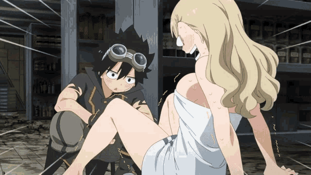 a girl in a white towel sits next to a boy with goggles on his head