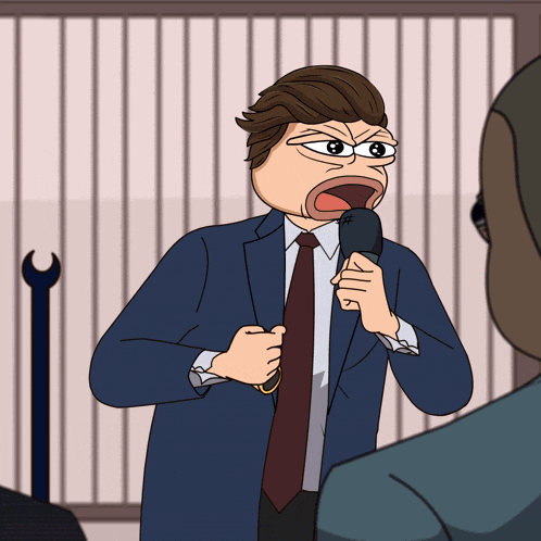 a man in a suit and tie is holding a microphone