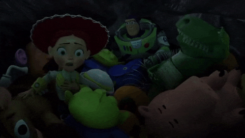 jessie from toy story is surrounded by stuffed animals including rex and buzz lightyear