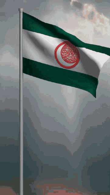a green white and red flag with arabic writing
