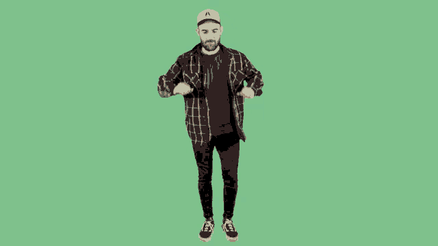 a man in a plaid shirt and a baseball cap is dancing