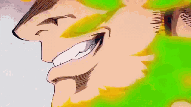 a close up of a man 's face with green flames coming out of it .
