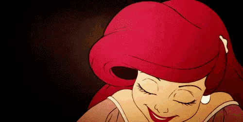 a close up of a cartoon character with red hair