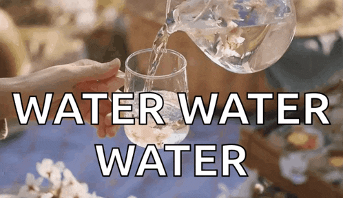 a glass of water is being poured from a pitcher with the words water water water below it