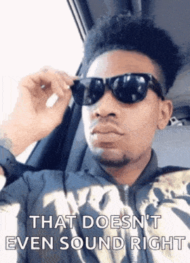 a man wearing sunglasses and a jacket is sitting in a car and says that does n't even sound right .