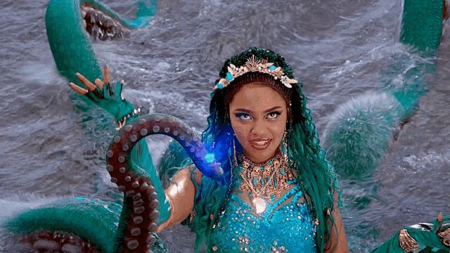 a woman with green hair and a crown is surrounded by green octopus tentacles