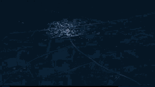 an aerial view of a town at night