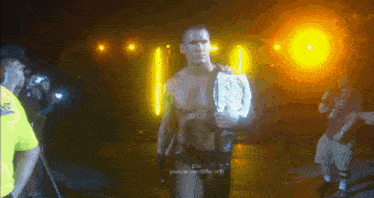 a man in a wrestling ring holding a championship belt that says ' dor youtube.com ' on the bottom