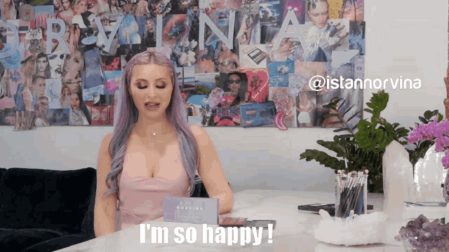 a woman with purple hair says i 'm so happy in front of a collage of pictures
