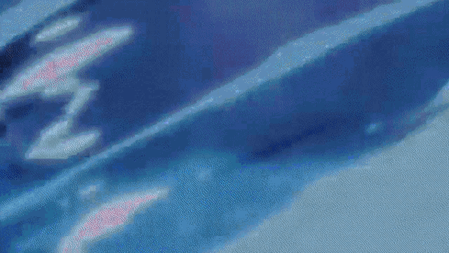 a blurry picture of a person 's face in a blue room .