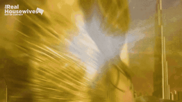 a real housewives logo is displayed on a yellow background