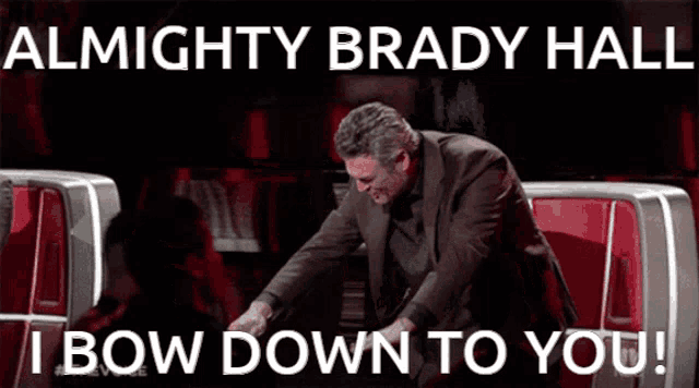 a man sitting in a chair with the words almighty brady hall i bow down to you written above him