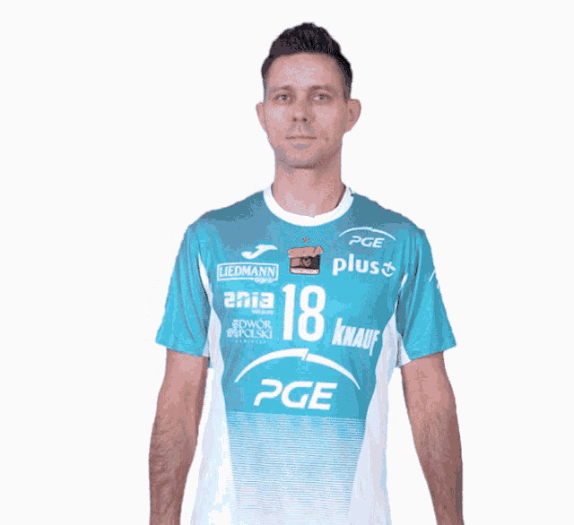 a man is wearing a shirt that says pge plus on it