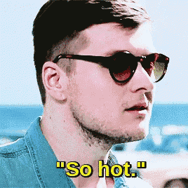 a man wearing sunglasses says so hot