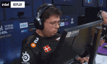 a man wearing a shirt that says #fazeup points at the camera