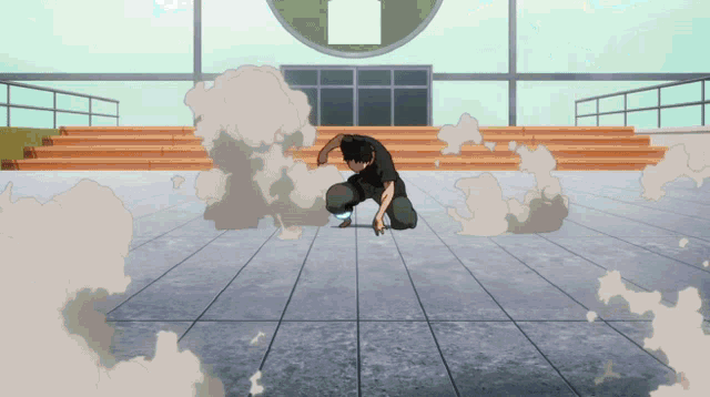 a man in a black shirt is kneeling on a tiled floor in front of a building