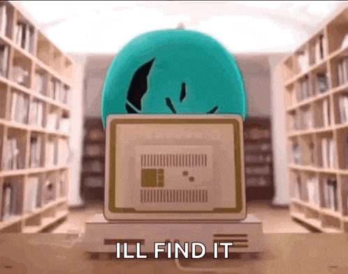 a computer is sitting in a library with the words `` ill find it '' written on the screen .