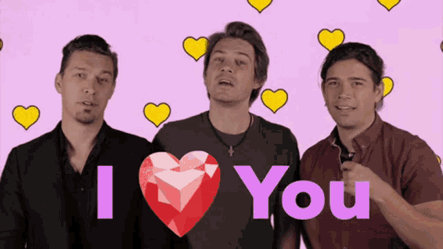 three men are standing in front of a pink background that says i love you on it