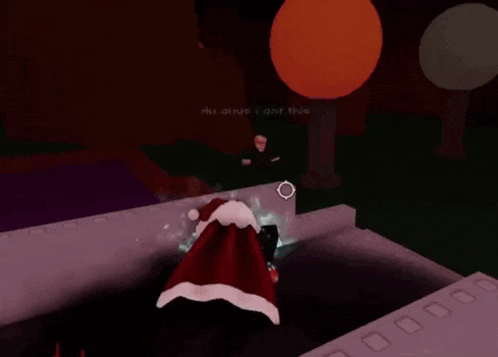 a person dressed as santa claus is standing in a dark room holding a bag of presents .