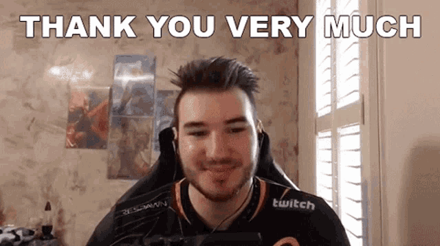 a man in a twitch shirt is giving a thank you very much message