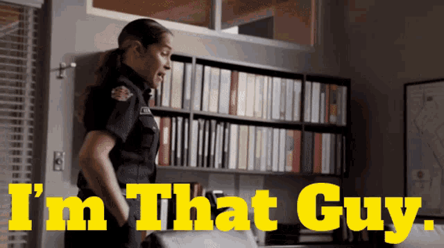 a woman in a police uniform says " i 'm that guy " in yellow letters