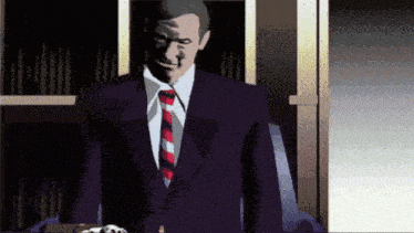 a man in a suit and tie is standing in a dark room