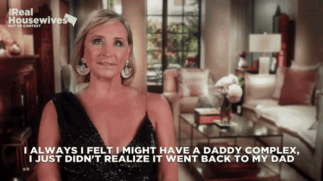 a woman in a black dress says " i always i felt i might have a daddy complex