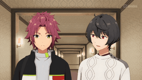 two anime characters are standing next to each other in a hallway with a bilibili logo on the bottom right