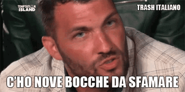 a man with a beard is wearing a plaid shirt and has the words trash italiano written on his face .