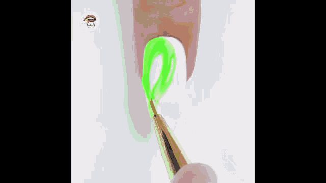 a person is applying neon green nail polish to a nail .
