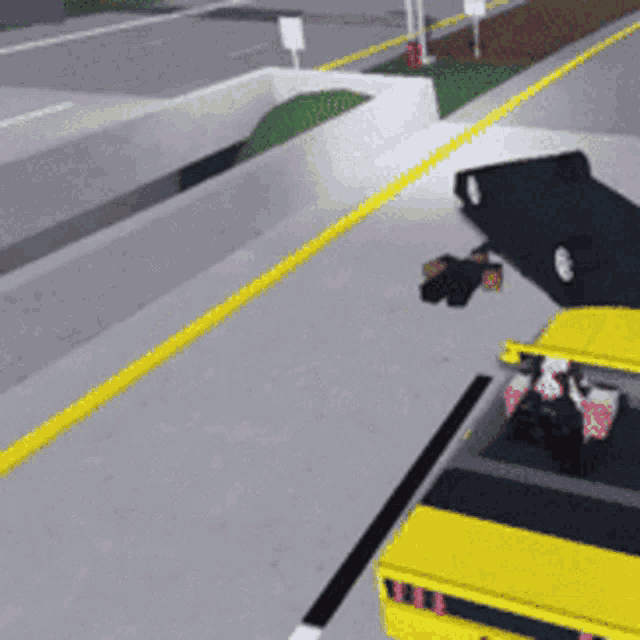 a yellow car is driving down a road next to a black car