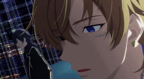 a close up of a man 's face with blue eyes