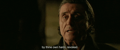 a man in a dark room with the words by thine own hand , revoked .