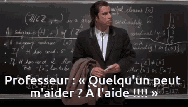 a man in a suit stands in front of a blackboard that says " professor "