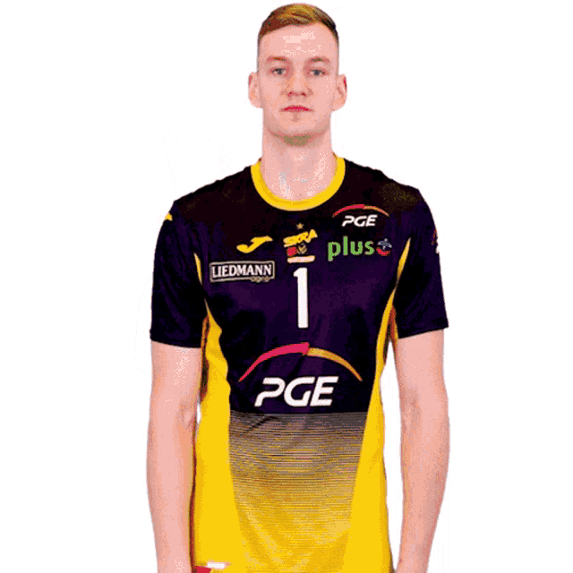 a man wearing a yellow and purple pge jersey